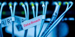 Photo of computer cables with label Data Breach in red